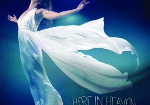 Woman in flowing white dress with arms raised, against a blue background. Text reads "here in heaven, Donna De Lory.