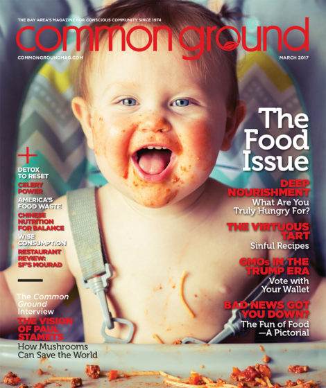 Cover of "Common Ground" magazine, March 2017 issue, featuring a smiling toddler covered in spaghetti sauce, titled "The Food Issue".