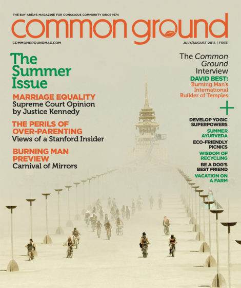 Cover of "Common Ground" magazine, July 2015 issue, featuring a desert scene with bicyclists and a large wooden tower structure in the background.