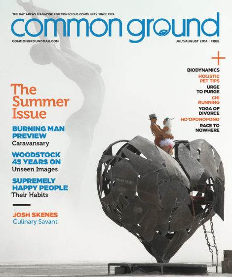 Magazine cover with a sculpture of a large hand and sphere, featuring a man with a rooster on his shoulder, highlighting the August 2014 "common ground" issue.