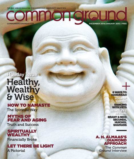 Cover of "common ground" magazine featuring a close-up image of a laughing buddha statue, with headlines about health and spirituality for the December 2014/January 2015 issue.