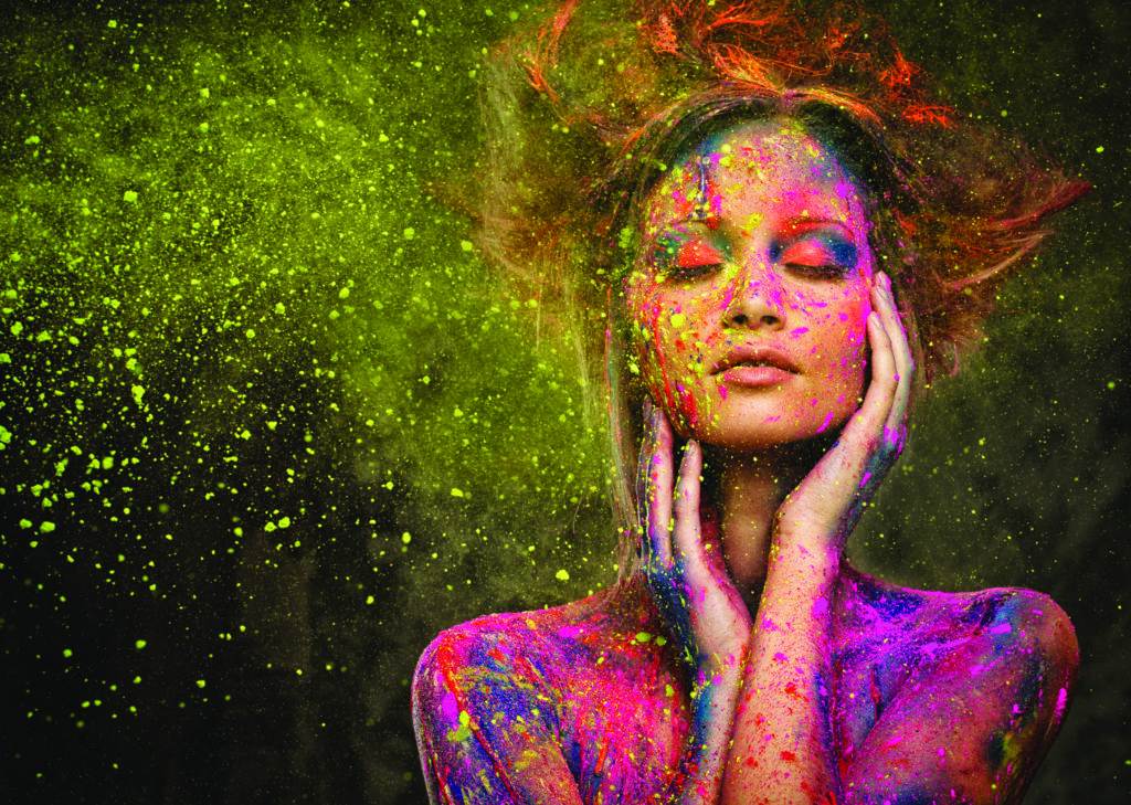 woman with bright makeup and body art