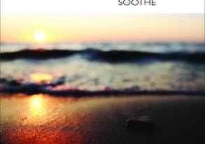 Album cover titled "shambhu - soothe" featuring a close-up of a pebble on a beach during sunset, with the ocean gently lapping at the shore and the sun casting a golden