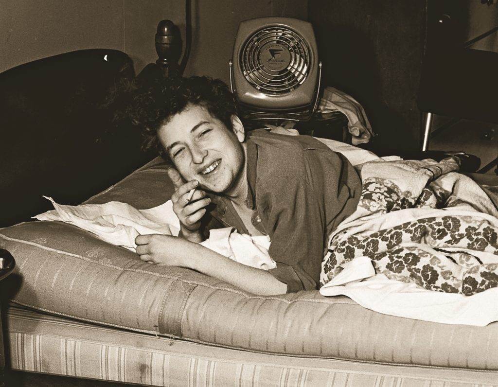 smoking Bob Dylan on the bed