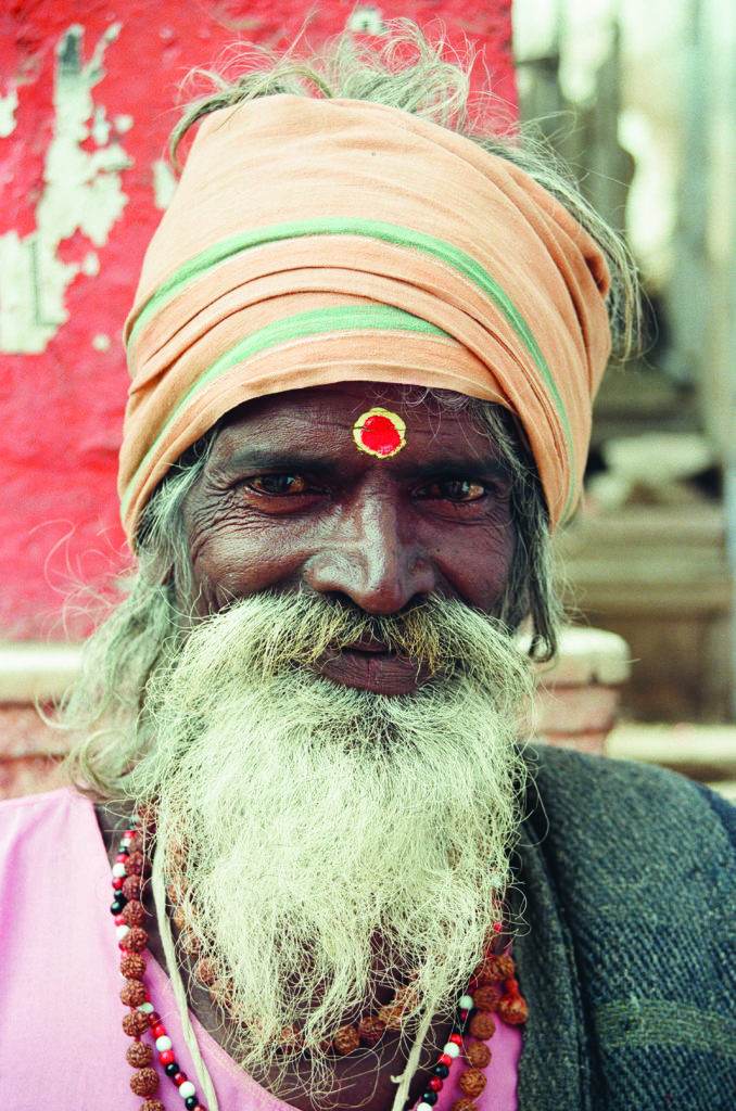 man with red spot between eyes