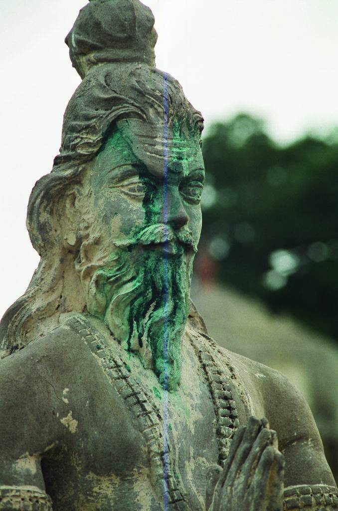 statue with green color on the face