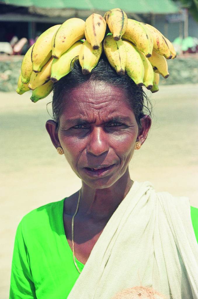 black woman with bananas on her head