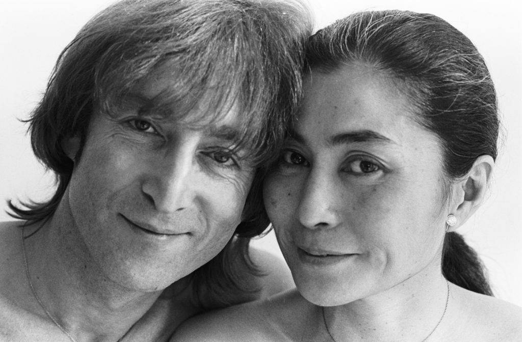 John and Yoko are smiling