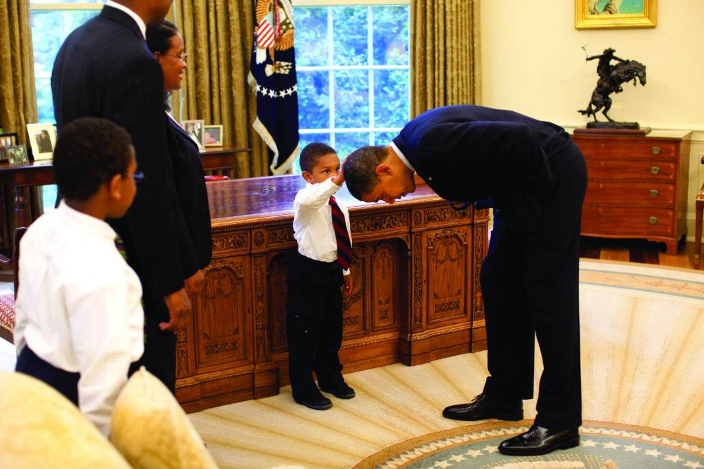 With a young visitor who wanted to see if the President’s haircut felt like his own, May 2009