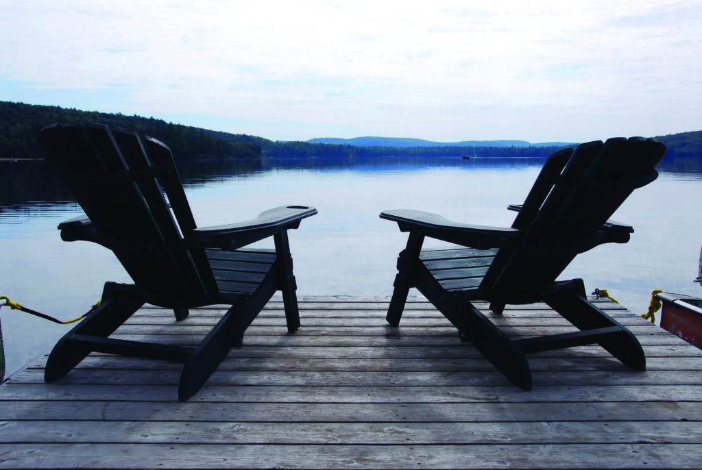 two chairs near the water