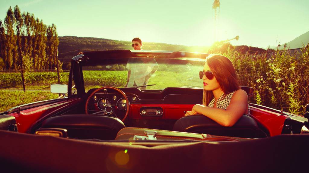 man and woman near the car