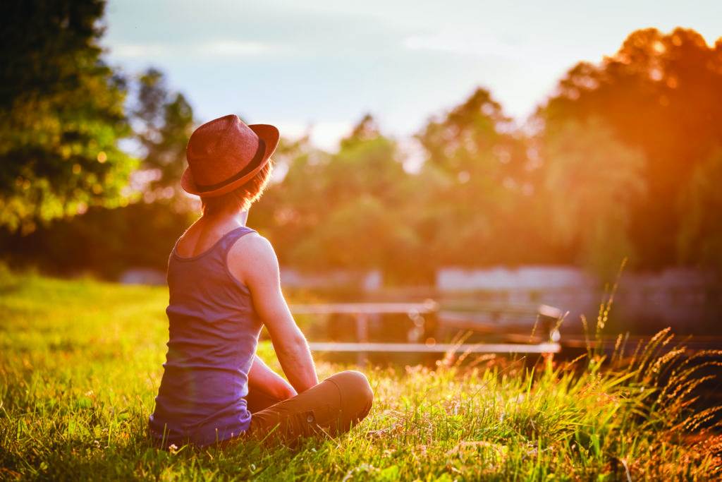 girl is sitting in the grass