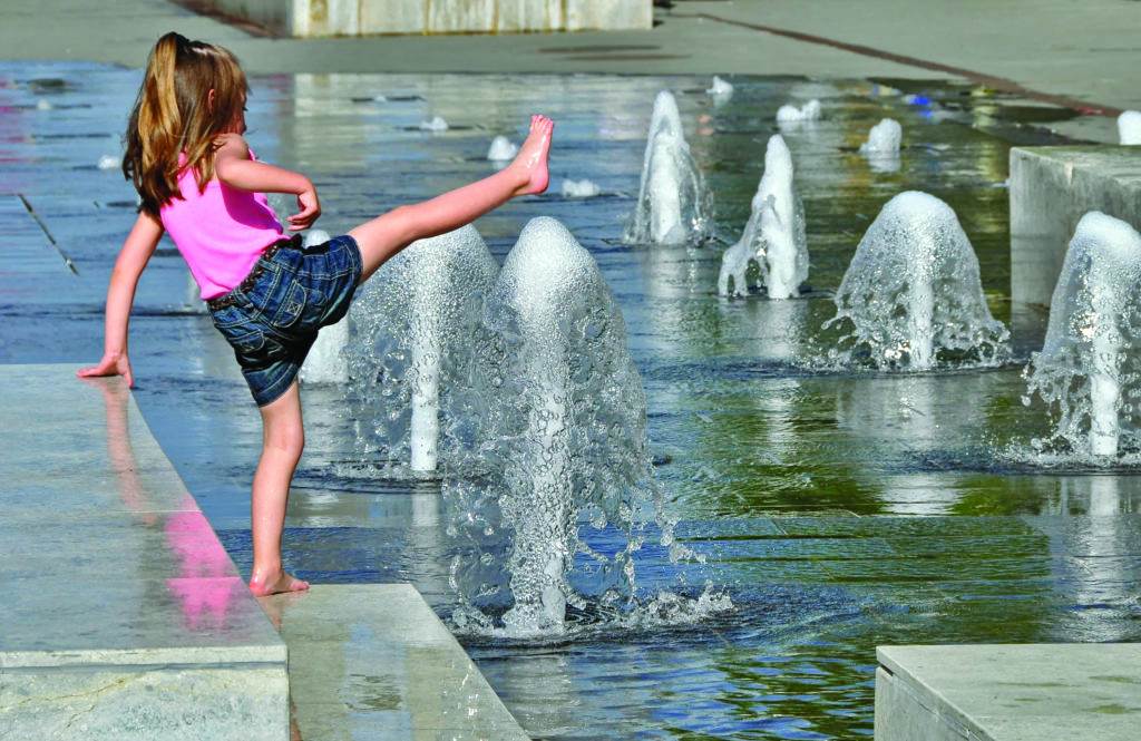 little girl by the fountain