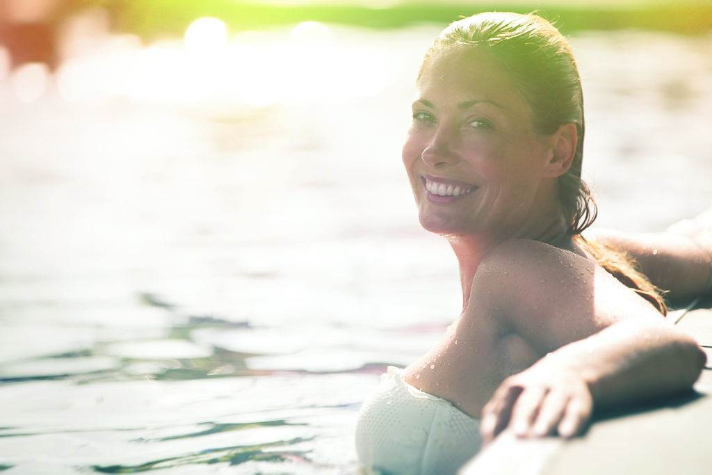 smiling woman in water