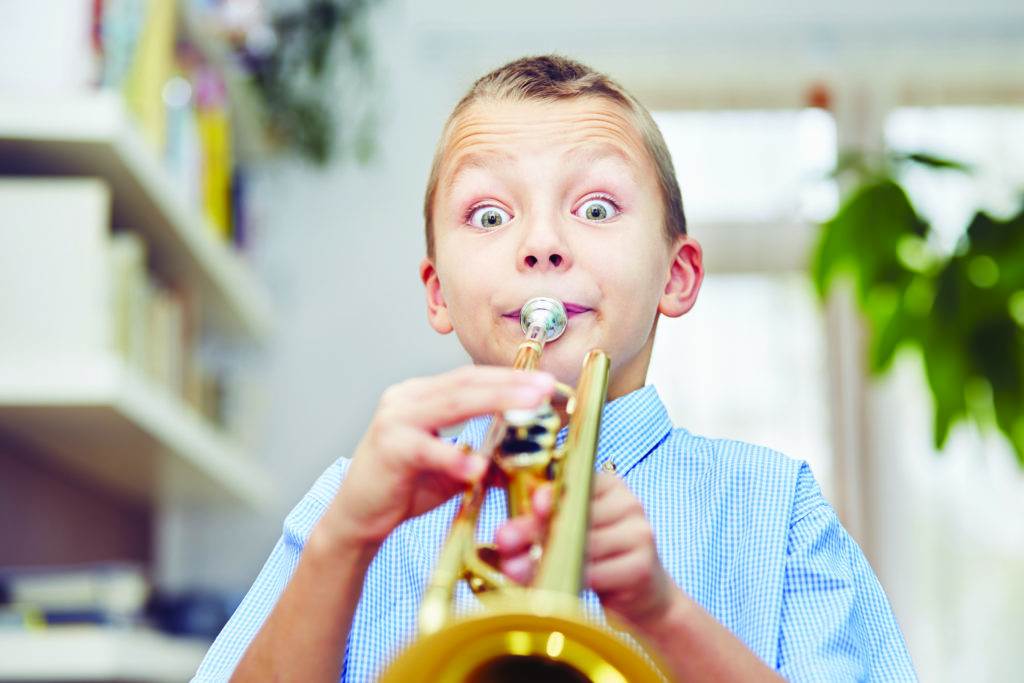 boy playing the trumpet