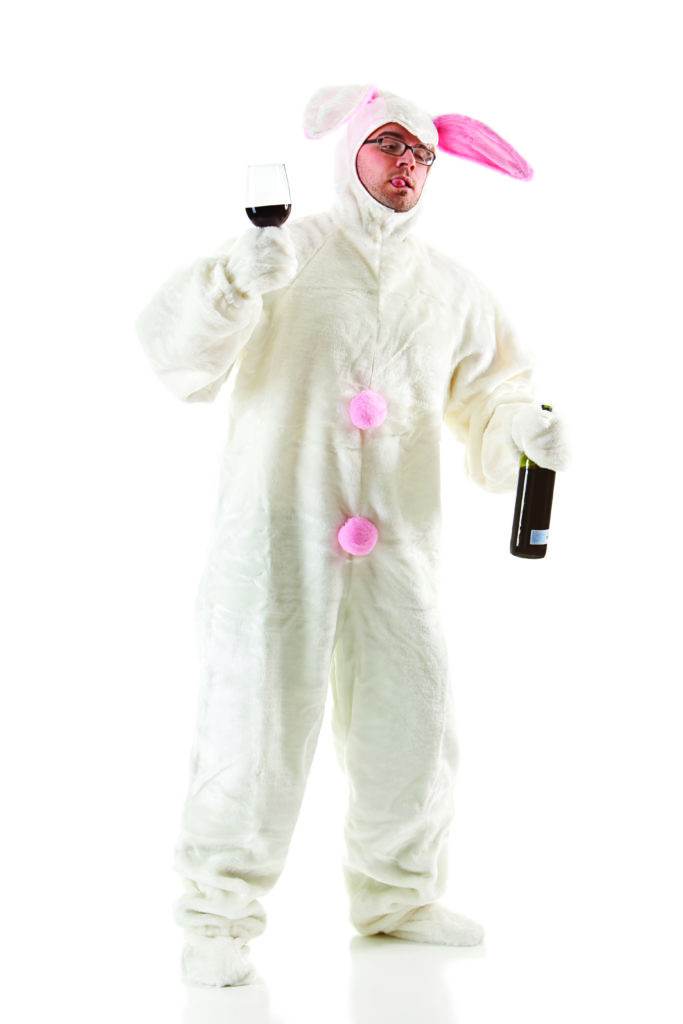 man in a rabbit costume with wine