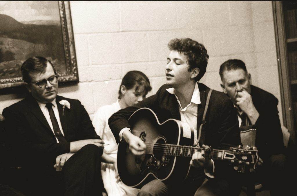 Bob Dylan is playing guitar